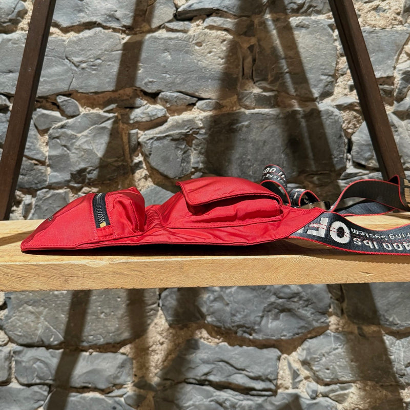 A side view of Off-White Red Nylon Industrial Strap Crossbody Bag
