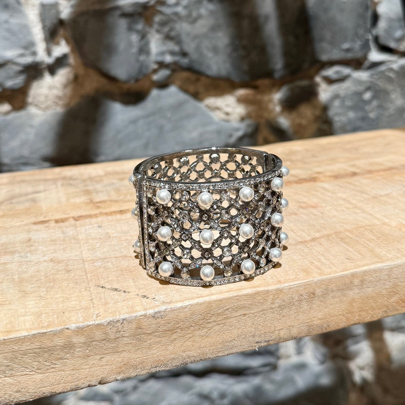 A side of Oscar De La Renta Crystal Pearl Embellished Hinged Cuff Bracelet