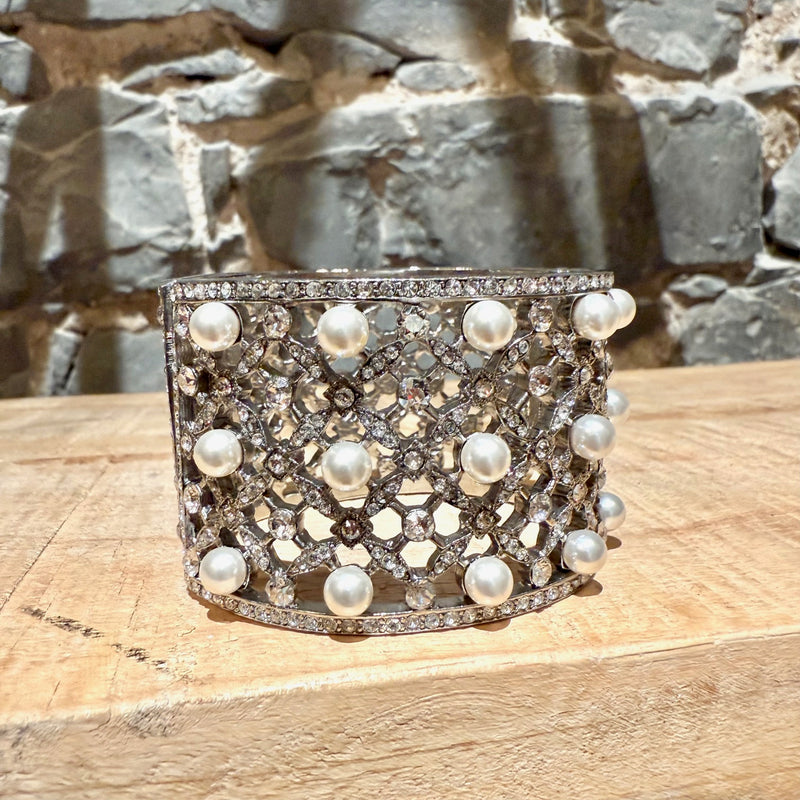 A side of Oscar De La Renta Crystal Pearl Embellished Hinged Cuff Bracelet