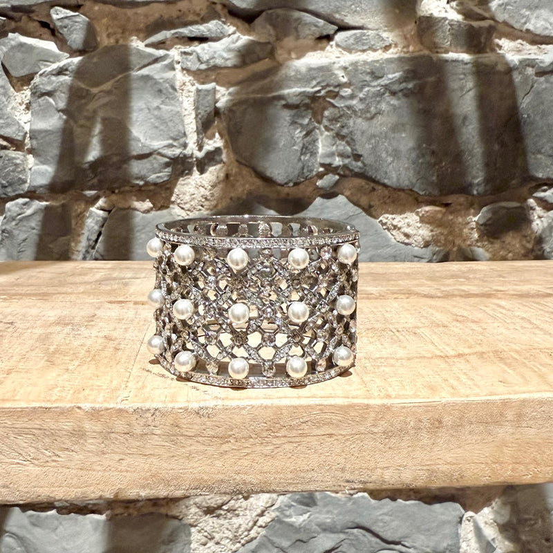 A side of Oscar De La Renta Crystal Pearl Embellished Hinged Cuff Bracelet