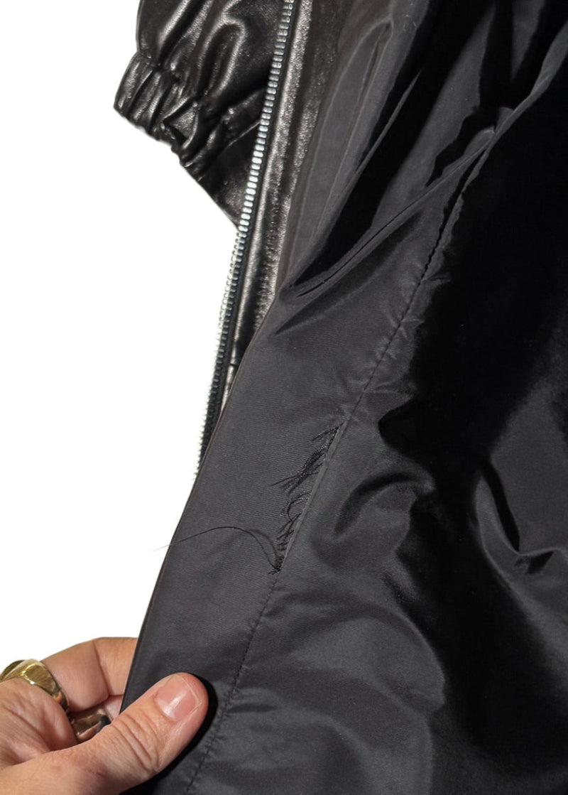 Close-up on lining fabric of Prada Black Leather Nylon Lined Crop Sleeves Trench Coat