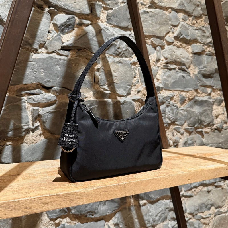 Side front view of Prada Black Tessuto Nylon Re-Edition 2000 Bag