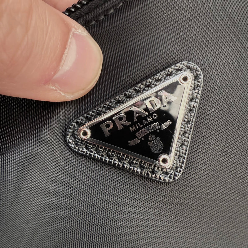 Brand plaque of Prada Black Tessuto Nylon Re-Edition 2000 Bag