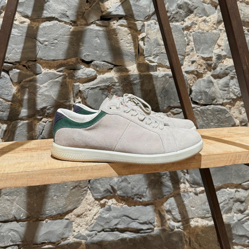 Prada Linea Rossa light grey suede low-top sneakers with green accents, showing details, wear, and branding.