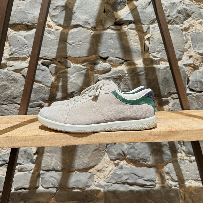 Prada Linea Rossa light grey suede low-top sneakers with green accents, showing details, wear, and branding.