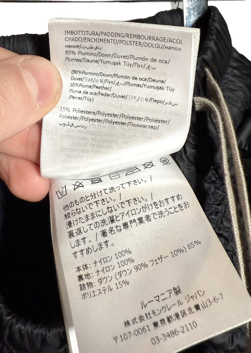 Material and care labels of Rick Owens X Moncler Black Quilted Boxer Shorts