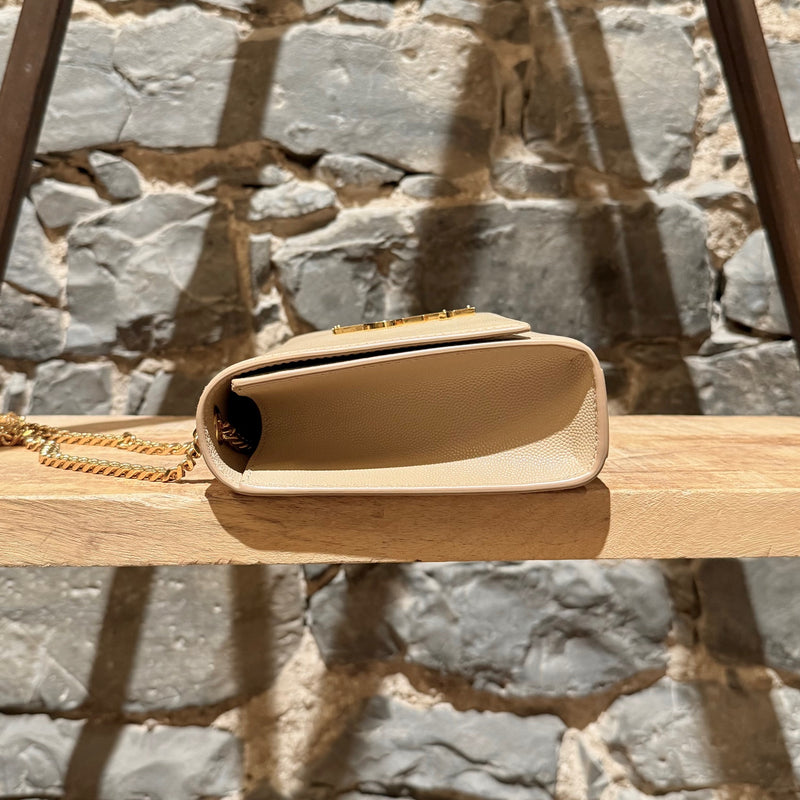 A side view of Saint Laurent Beige Grain de Poudre Medium Kate Chain Bag