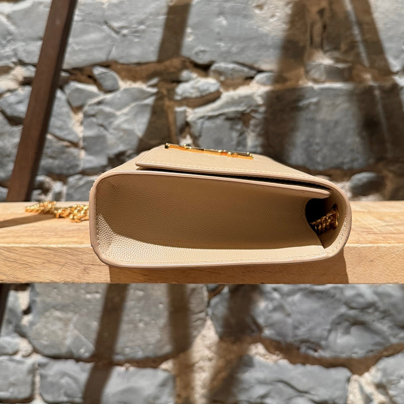 A side view of Saint Laurent Beige Grain de Poudre Medium Kate Chain Bag