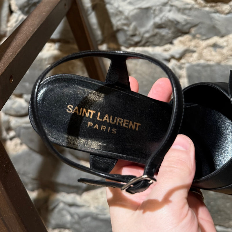 Brand stamp of Saint Laurent Black Leather Wood Platform Candy Sandals