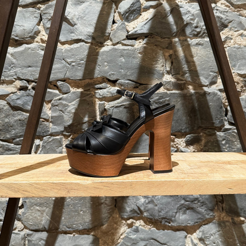 A side view of Saint Laurent Black Leather Wood Platform Candy Sandals