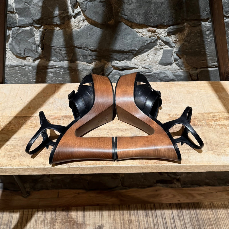 Side-by-side view of Saint Laurent Black Leather Wood Platform Candy Sandals