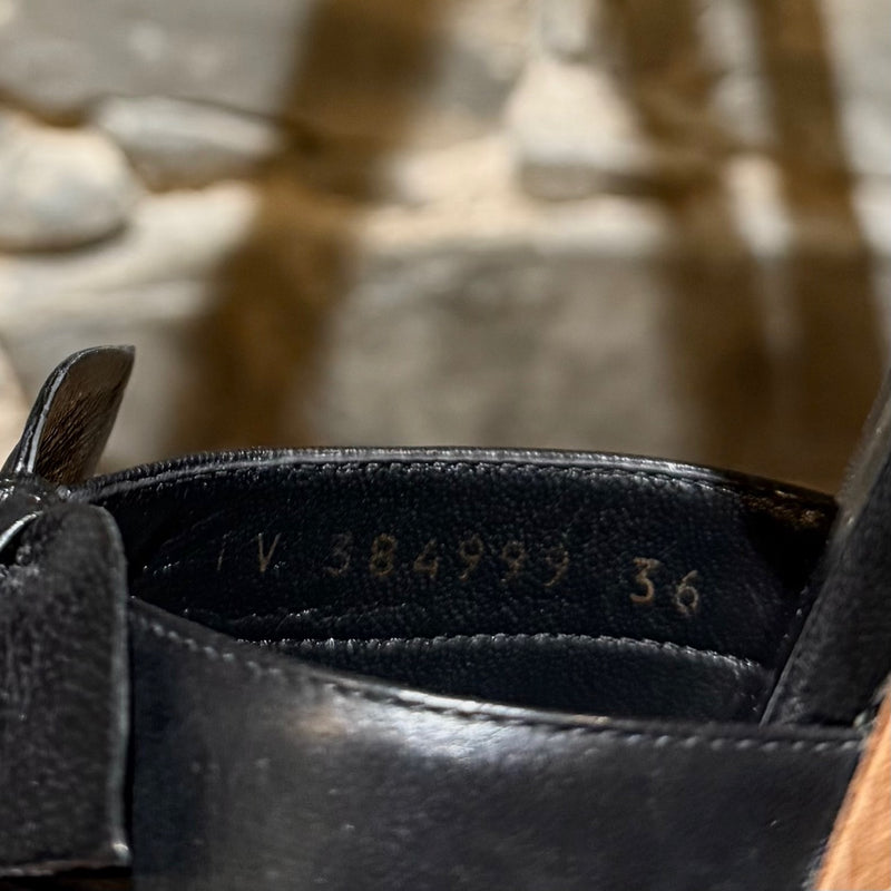 Serial number stamp of Saint Laurent Black Leather Wood Platform Candy Sandals