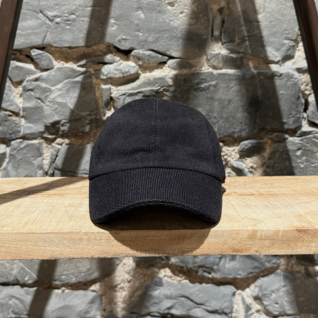 Front view of The Row Black Silk Knit Caspian Baseball Cap