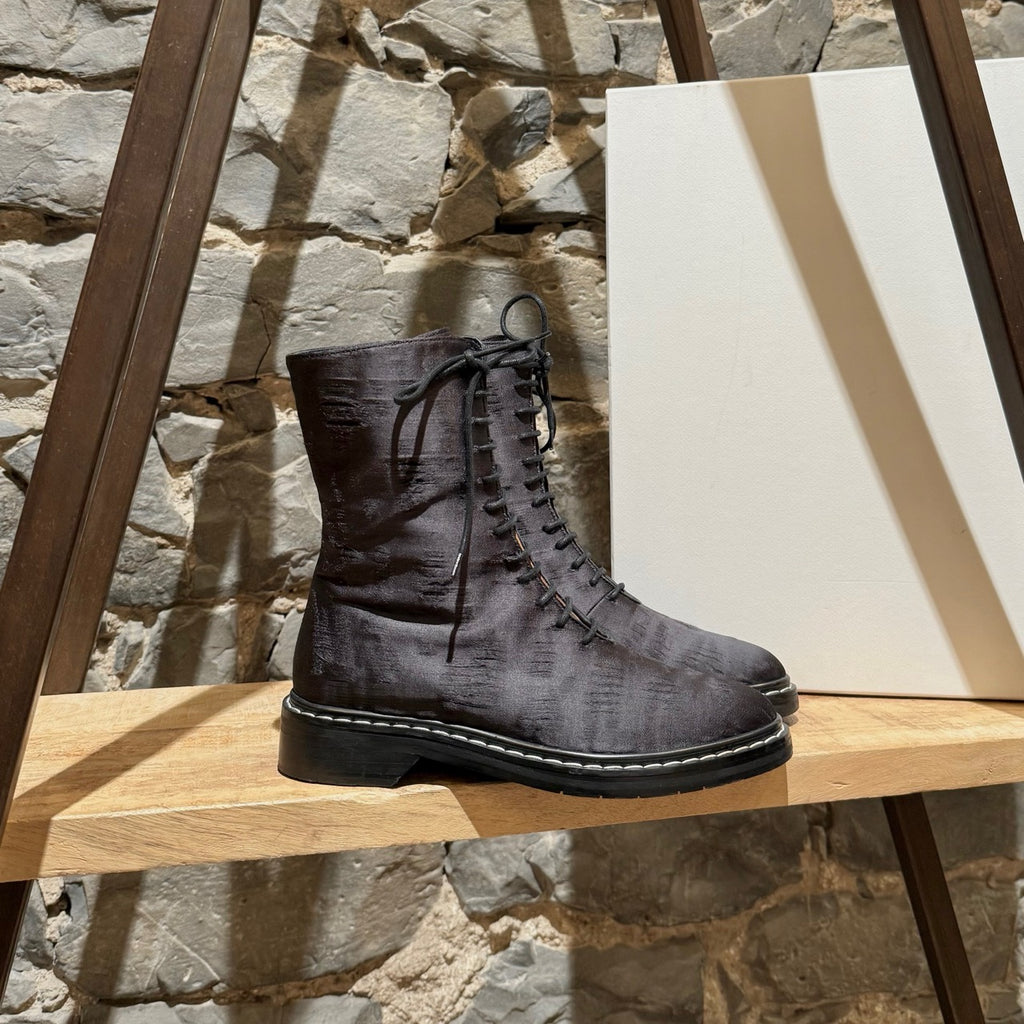 Main photo of The Row Black Silk Wool Fara Distressed Combat Boots