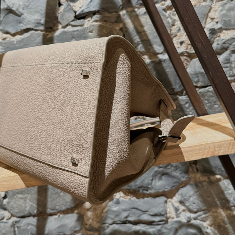 Close-up side view of The Row Dark Taupe Grained Leather Soft Margaux 15 Bag