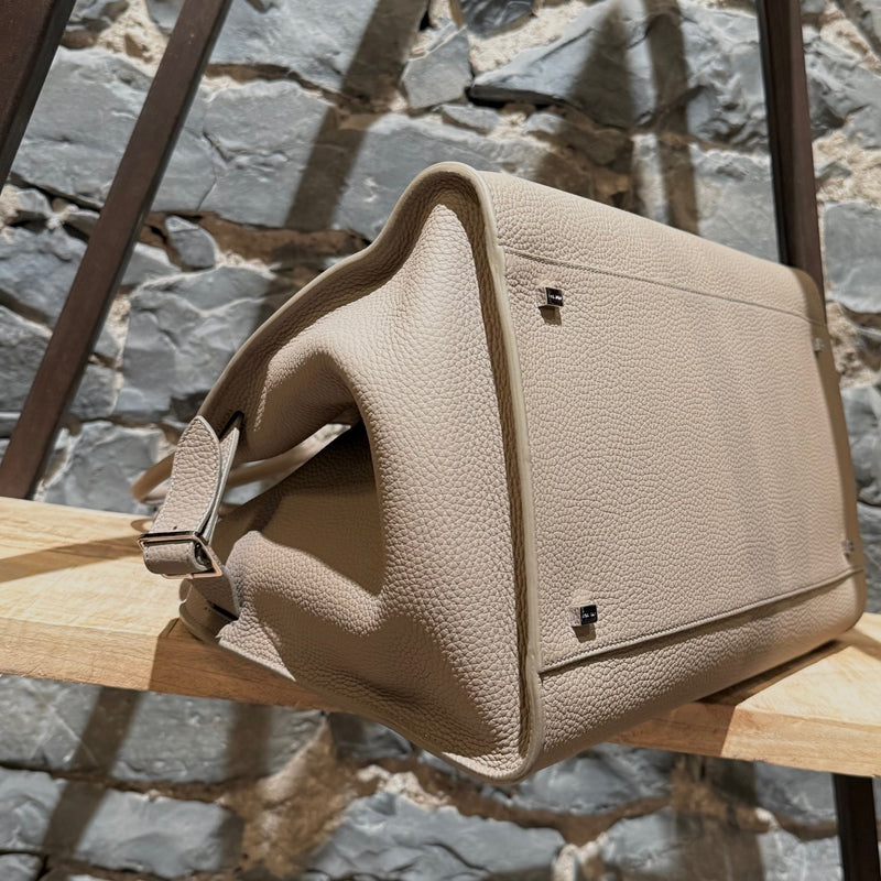 Close-up side view of The Row Dark Taupe Grained Leather Soft Margaux 15 Bag