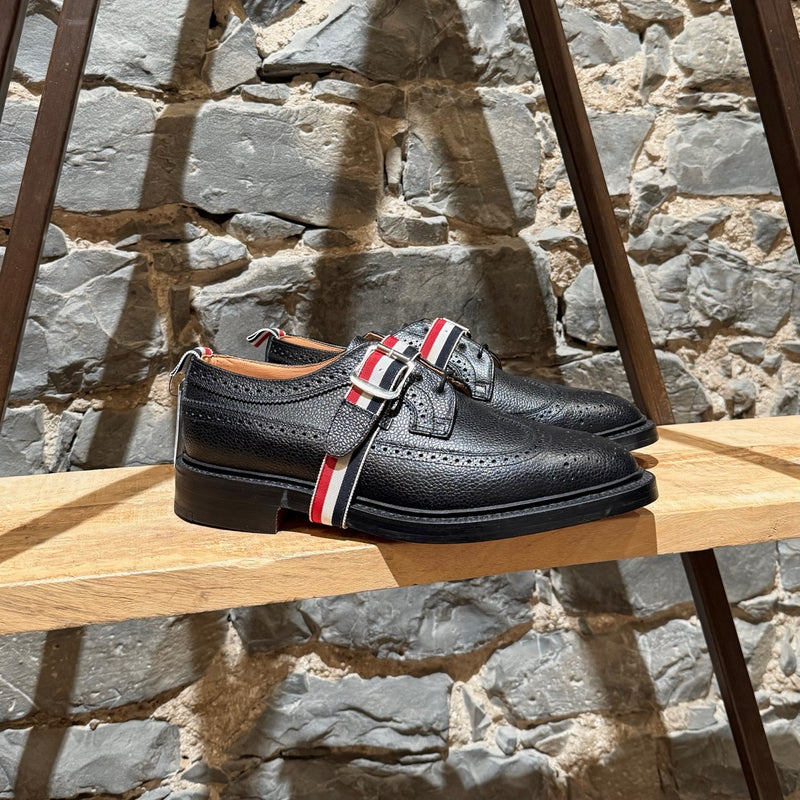 Main photo of Thom Browne Black Pebbled Grosgrain Tricolour Strap Long Wingtip Shoes
