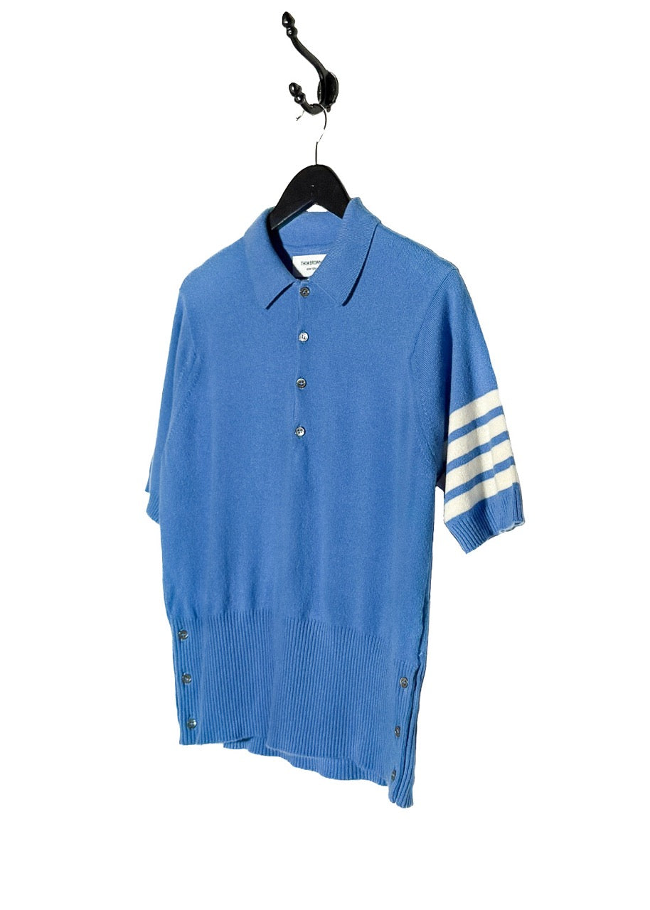 Side front view of Thom Browne Blue Cashmere 4-Bar Short Sleeve Knit Polo Shirt