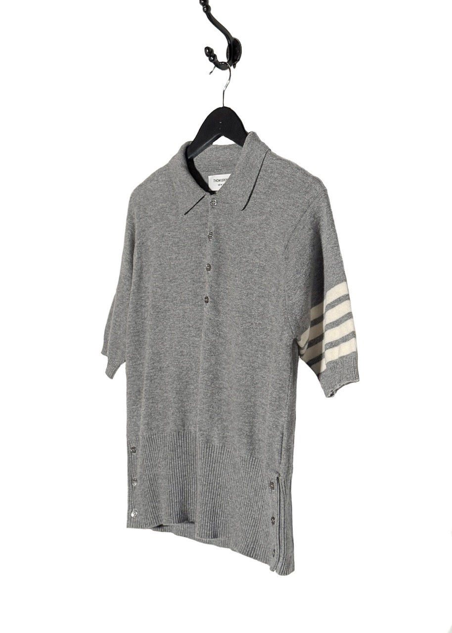 Side front view of Thom Browne Grey Cashmere 4-Bar Short Sleeve Knit Polo Shirt
