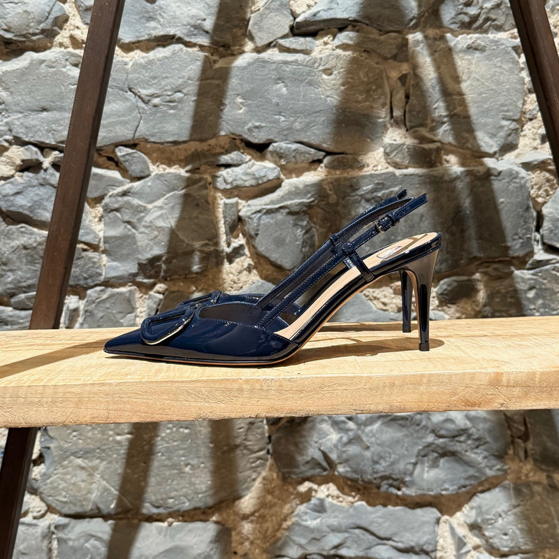 One side of Valentino Navy Blue Patent Vlogo Slingback Pumps