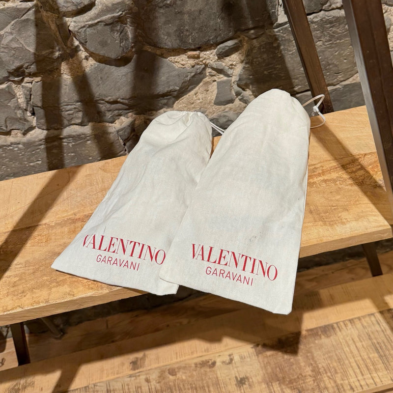 Branded dustbags of Valentino Brown Leather Gold Studded No Limit Gladiator Flat Sandals