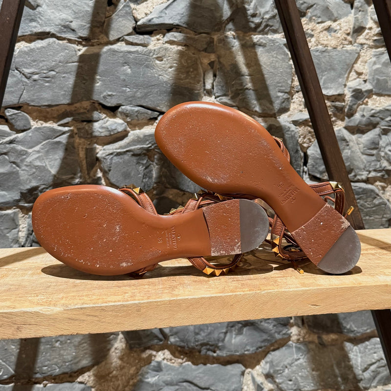 Branded outsole of Valentino Brown Leather Gold Studded No Limit Gladiator Flat Sandals