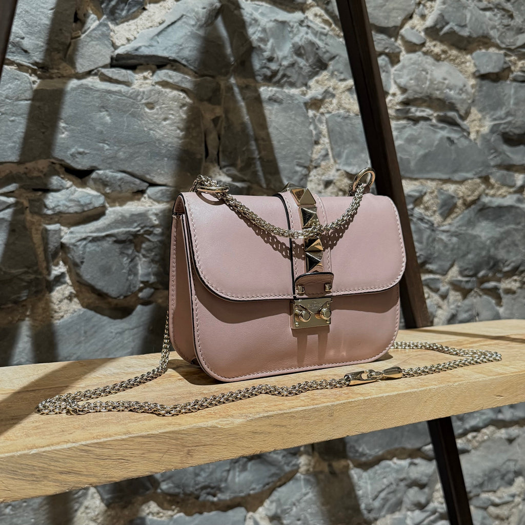 Side front view of Valentino Poudre Pink Leather Small Glam Lock Chain Bag