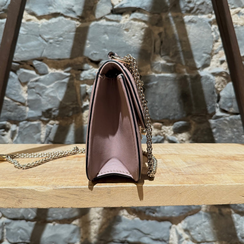 A side view of Valentino Poudre Pink Leather Small Glam Lock Chain Bag