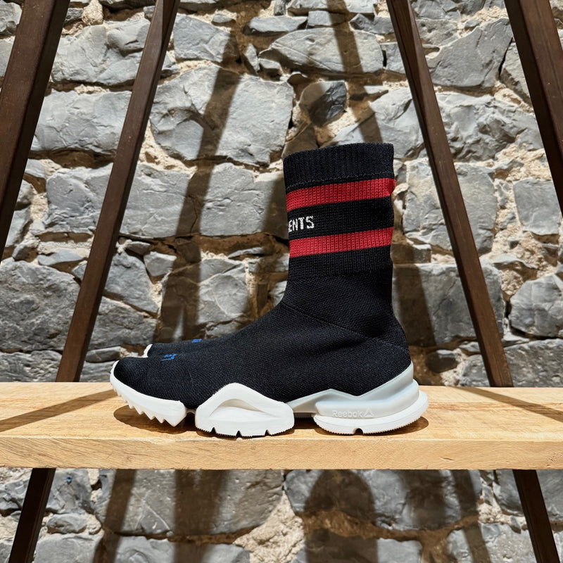 A side view of Vetements x Reebok Black Sock Pump Logo High-top Sneakers