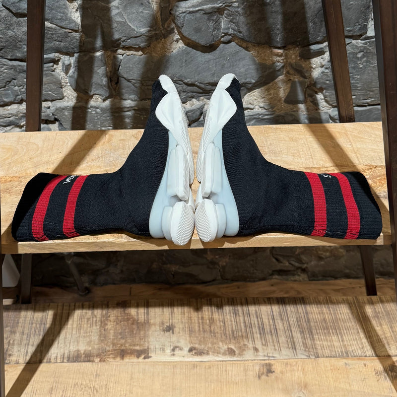 Side-by-side view of Vetements x Reebok Black Sock Pump Logo High-top Sneakers