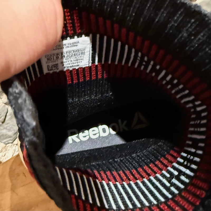 A branded insole of Vetements x Reebok Black Sock Pump Logo High-top Sneakers