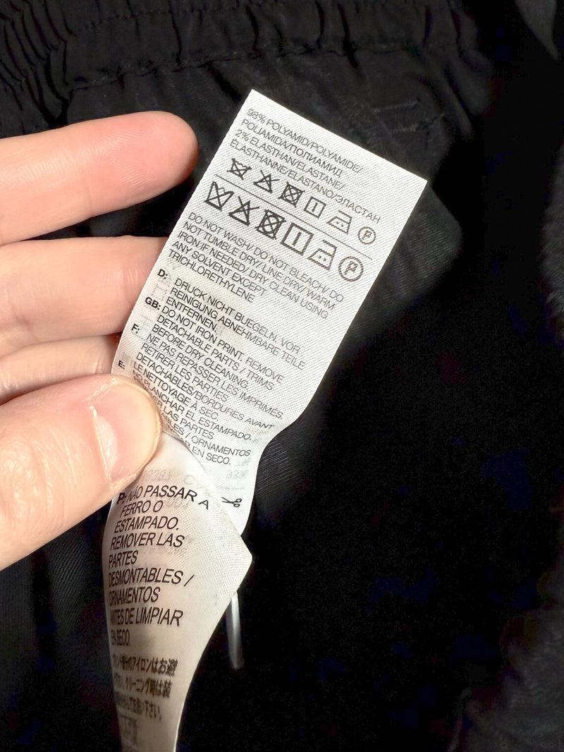 Care label of Y-3 Black Utility Cuffed Cargo Pants