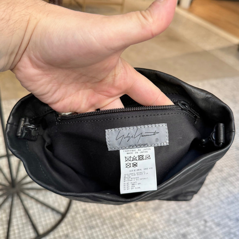 Pocket and labels of Yohji Yamamoto Black Crinkled Leather Crossbody Bag
