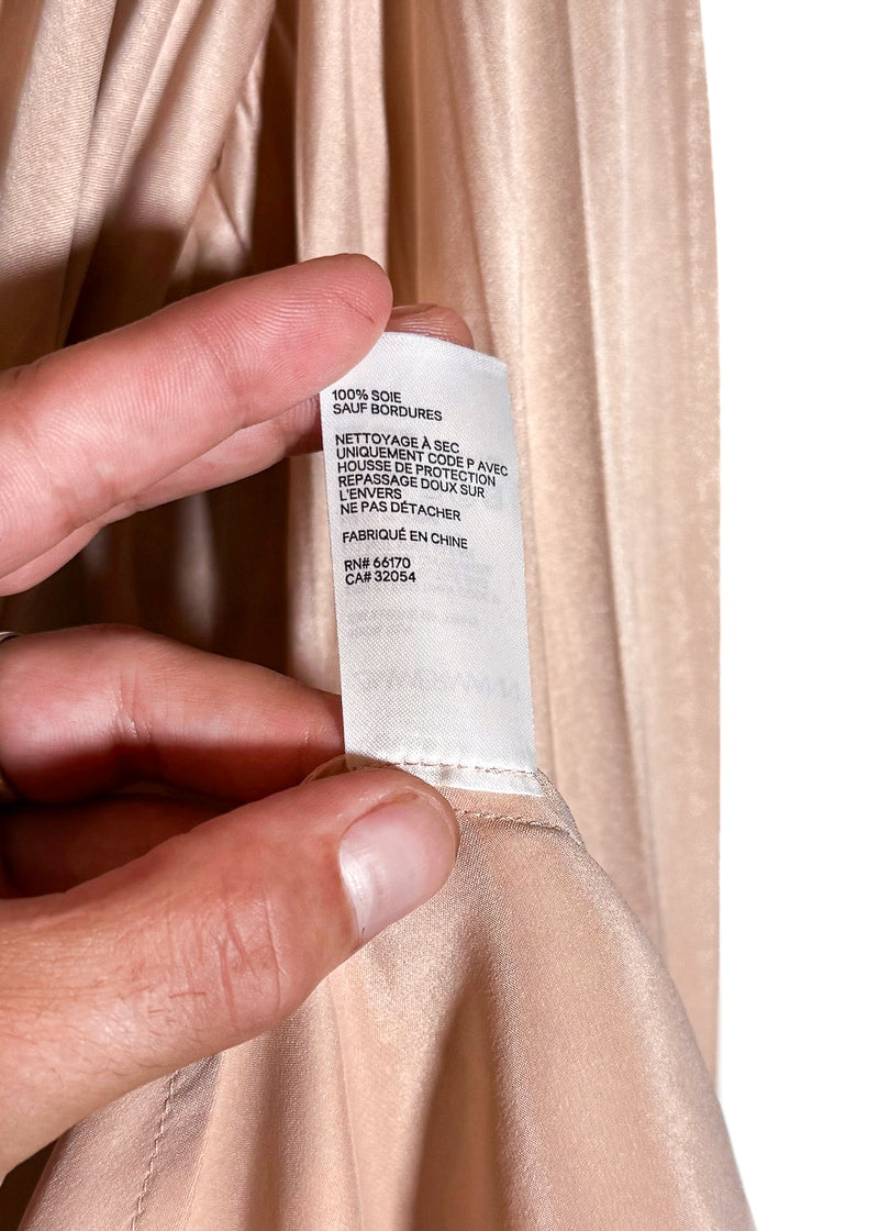 Material, care and origin label (french) of Zimmermann Dusty Pink Satin Classic Wrap Dress