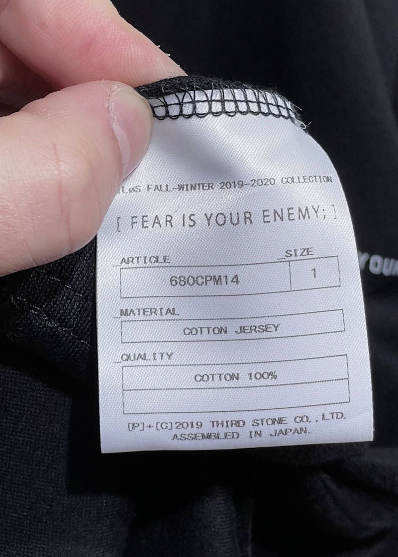 T-shirt noir à manches longues "Fear Is Your Enemy" de Nilos Julius