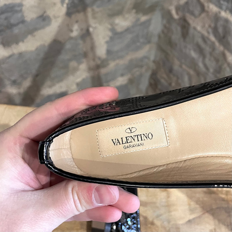 Chaussures plates à fleurs noires découpées Valentino